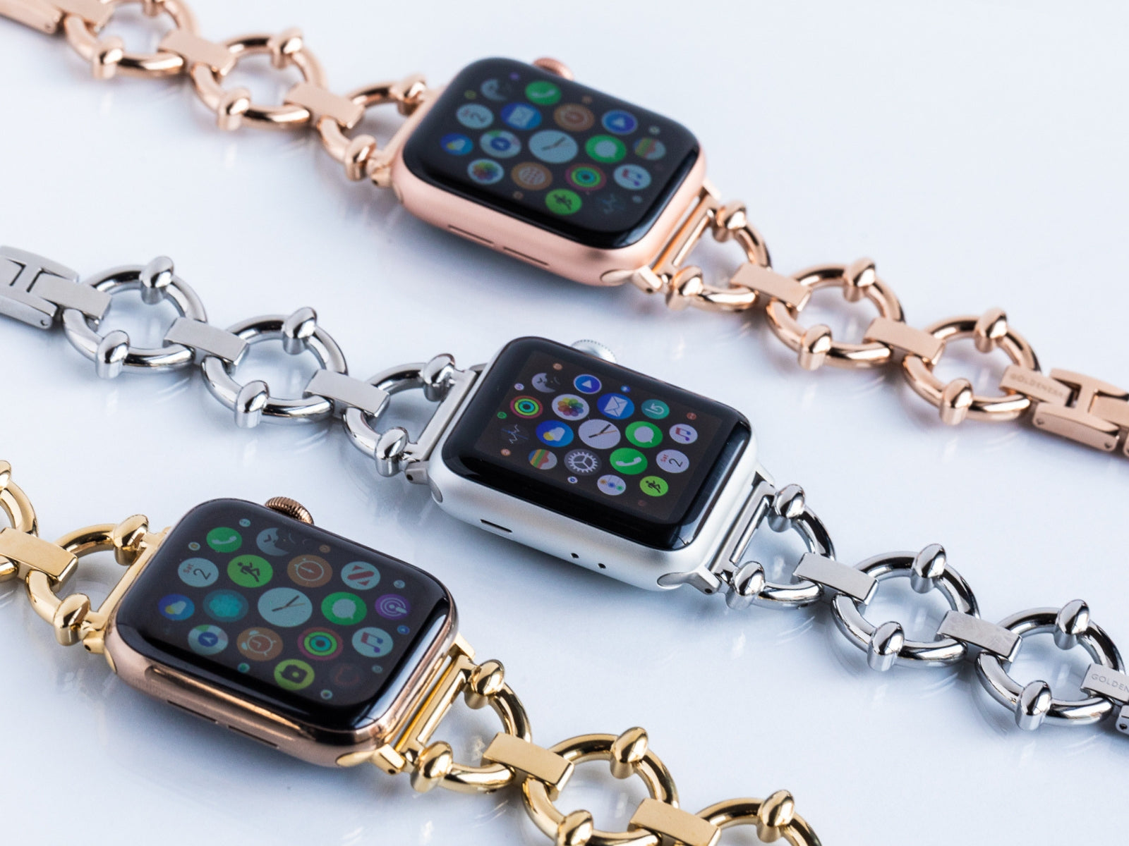 Designer Apple Watch bands - high quality stainless steel bands shown in three colors: yellow gold, silver, and roes gold